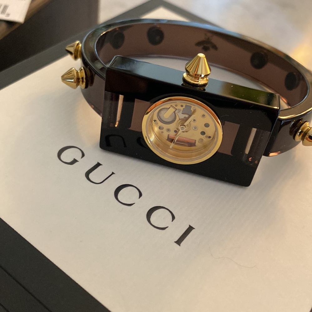 Gucci Black Plexi Watch Skeleton Gold Studs. Mint condition. Orignal packaging